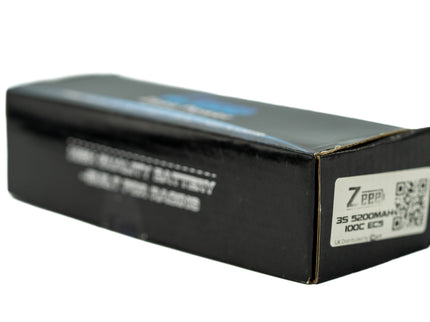Black battery packaging with text and a QR code on a white background