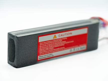 Rectangular electronic device with a red warning label on a white background