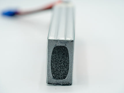 Metallic rectangular bar with textured surface on a white background
