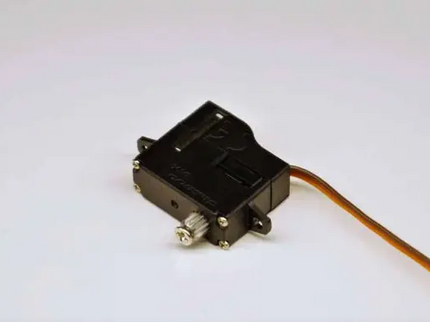 Black electronic component with a cable on a white background