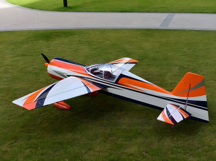Model airplane on grass with a road in the background