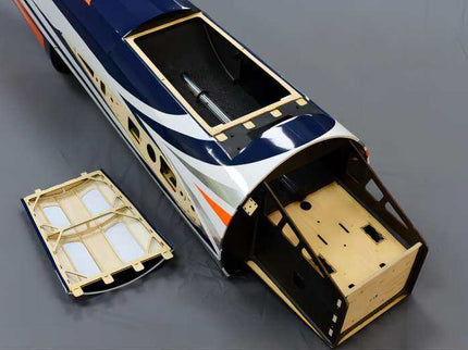 Model plane body with open doors on a gray background