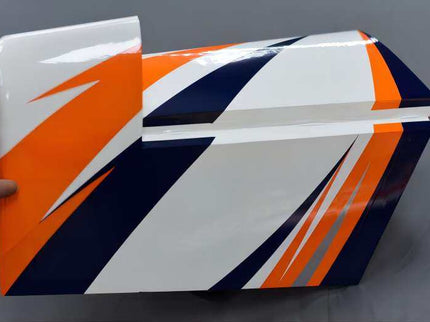 tailplane orange, white, and blue design held against a gray background
