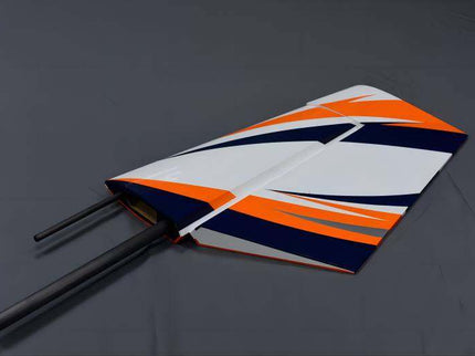 Orange, white, and blue model airplane wing on a gray background