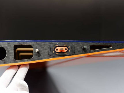 Close-up of a wing munting side with connectors and switches on a dark background