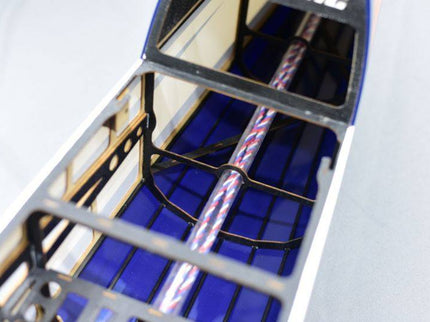 Close-up of a model plane with a detailed interior on a white background
