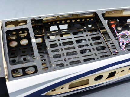 Close-up of skywing fuselage with visible labels and components on a gray background