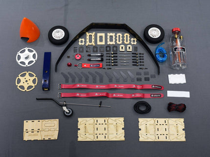 Collection of model building parts on a gray background
