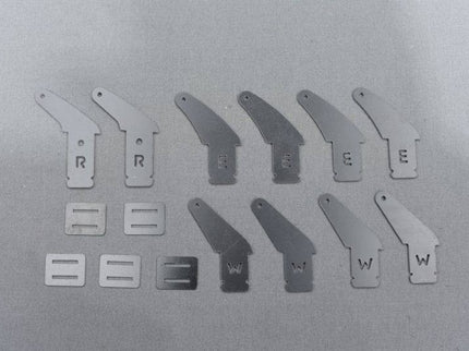 Set of control horns with letters on a metallic surface