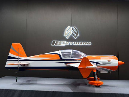 Model airplane on a stand with 'RC skywing' logo in the background