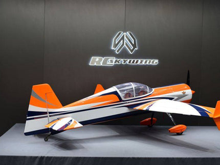 Model airplane with orange, white, and blue design on a dark background with a logo.