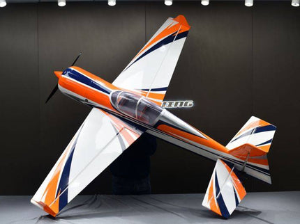 Model airplane with orange and white design on a dark background