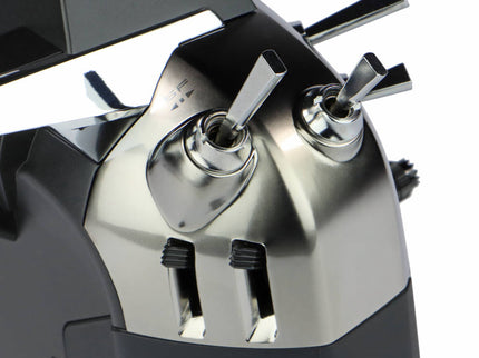 Close-up of Futaba T26SZ Pro 26‑Channel Air Radio switch on white background