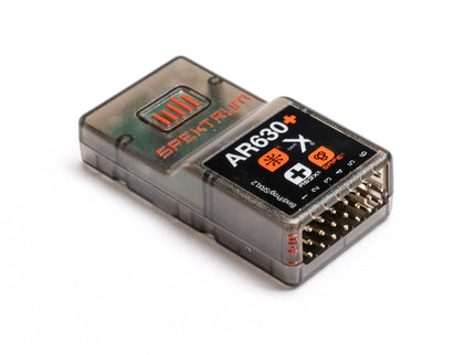 Electronic module with 'Spektrum' branding on a white background