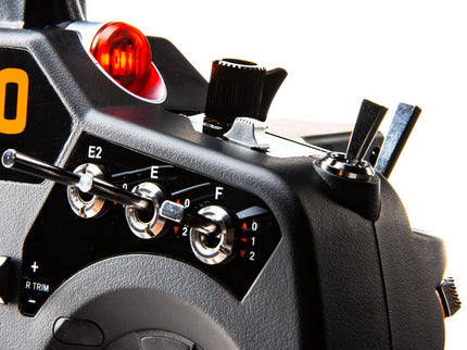 Close-up of a remote control device with various controls and indicators.