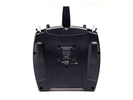 Back view of a black electronic device on a white background