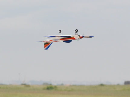 Phoenix Model PH006-SCANNER 57" Model airplane flying against a plain background