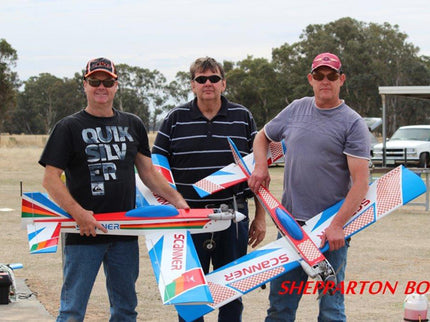 Three men holding Phoenix Model PH006-SCANNER 57" model airplanes with branding in an outdoor setting.