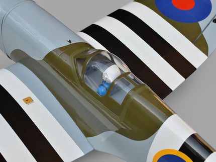 Phoenix Model Spitfire 61" ARF V2 with Electric Retracts Close-up of a model airplane with striped design on a gray background