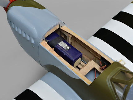 Phoenix Model Spitfire 61" ARF V2 with Electric Retracts Close-up of an airplane's cargo hold with a Battery and wooden mount.