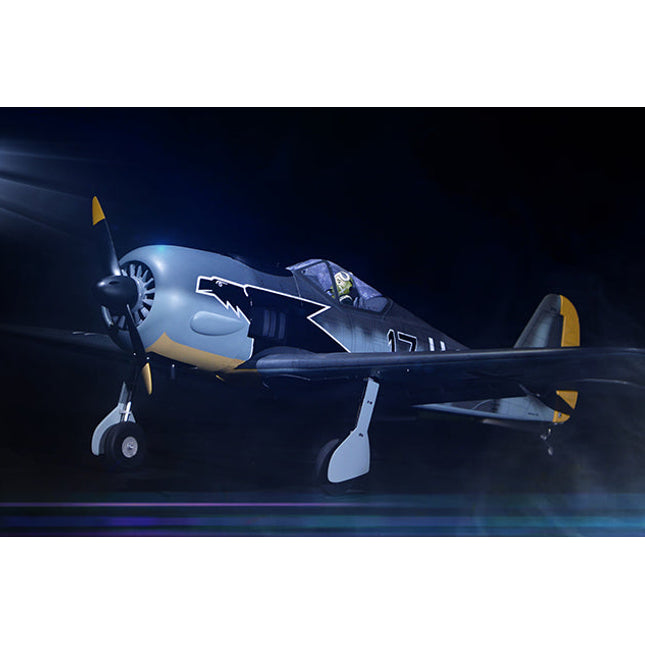 Phoenix Model FOCKE WULF WW2 airplane with propeller and lights against a dark background