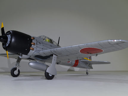 Phoenix Model ZERO A6M Model airplane with a propeller on a plain background