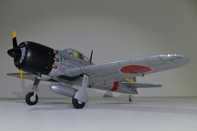 Phoenix Model ZERO A6M Model airplane with a propeller on a plain background
