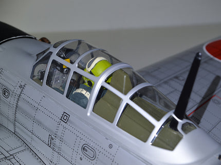 Phoenix Model ZERO A6M Model airplane with cockpit and propeller on a plain background