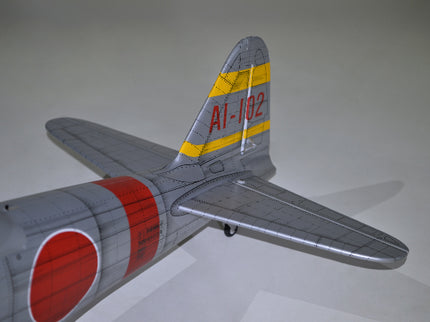 Phoenix Model ZERO A6M Model airplane with red circle and yellow stripe on a white background
