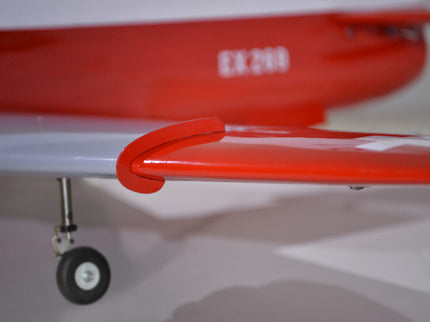Phoenix Model BAE Hawk Jet 72" ARF V2 Close-up of a red airplane wing with a visible wheel on a white background