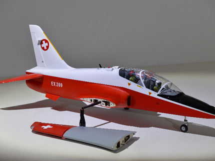 Phoenix Model BAE Hawk Jet 72" ARF V2 Model of a red and white jet with Swiss flag design on a gray background