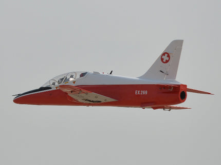 Phoenix Model BAE Hawk Jet 72" ARF V2 Red and white airplane with Swiss flag logo on a clear sky background