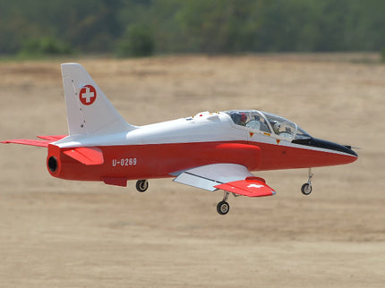 Phoenix Model BAE Hawk Jet 72" ARF V2 Red and white aircraft with Swiss cross logo on a grassy field