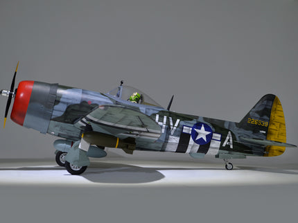 Phoenix Model P-47 Thunderbolt 79" ARF V2 with Electric Retracts Model airplane with camouflage paint job on a gray background