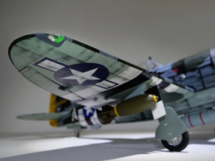 Phoenix Model P-47 Thunderbolt 79" ARF V2 with Electric Retracts Model airplane on a gray surface with a star emblem