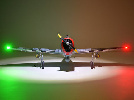 Phoenix Model P-47 Thunderbolt 79" ARF V2 with Electric Retracts Model airplane with illuminated lights on a dark background