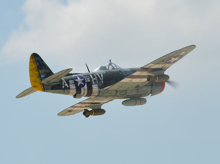 Phoenix Model P-47 Thunderbolt 79" ARF V2 with Electric Retracts Vintage military airplane flying against a clear blue sky
