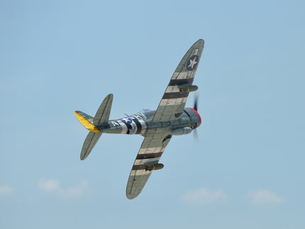 Phoenix Model P-47 Thunderbolt 79" ARF V2 with Electric Retracts Vintage airplane flying against a clear blue sky