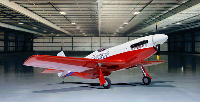 Phoenix Model STREGA 56'' W/Electric Retract Red and white airplane in a large hangar