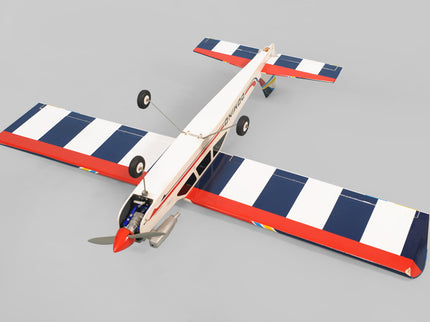 Phoenix Model Domino 62” Trainer Model airplane with red, white, and blue stripes on a gray background