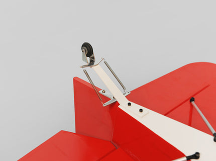 Red and white Phoenix Model DECATHLON model airplane tail plane with a propeller on a gray background