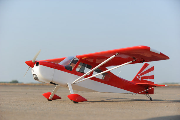 Red and white Phoenix Model DECATHLON  airplane on a clear day