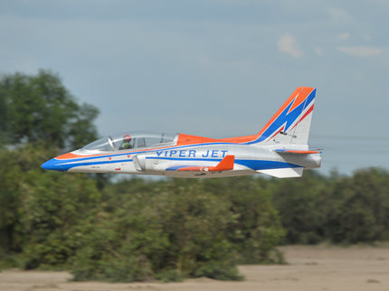 Phoenix Model VIPER JET 83'' With Electric Retract ARF V2 Model airplane labeled 'Viper Jet' flying against a clear sky with trees in the background