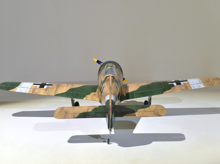Phoenix Model Focke Wulf 55" with Electric Retracts Model airplane with camouflage paint job on a gray background