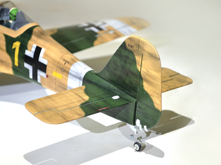 Phoenix Model Focke Wulf 55" with Electric Retracts Model of a World War II-era fighter plane with camouflage paint job on a white background