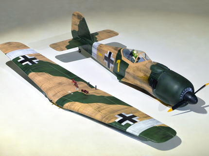 Phoenix Model Focke Wulf 55" with Electric Retracts Model of a vintage military aircraft with camouflage paint job on a white background