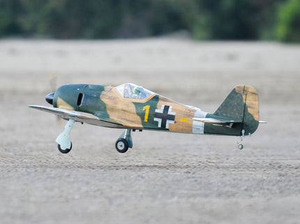 Phoenix Model Focke Wulf 55" with Electric Retracts Model airplane with camouflage paint job on a dirt surface