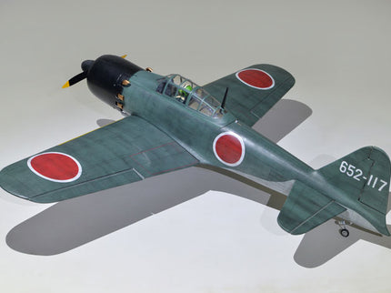 Phoenix Model ZERO A6M 55'' W/Electric Retract Model airplane with red circles and a visible serial number on a gray background
