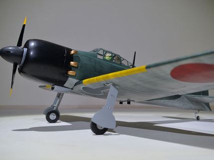 Phoenix Model ZERO A6M 55'' W/Electric Retract Model airplane with a propeller on a neutral background