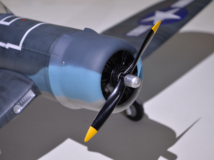 Phoenix Model F4U Corsair 59'' W/Electric Retract Close-up of a model airplane with a propeller on a neutral background